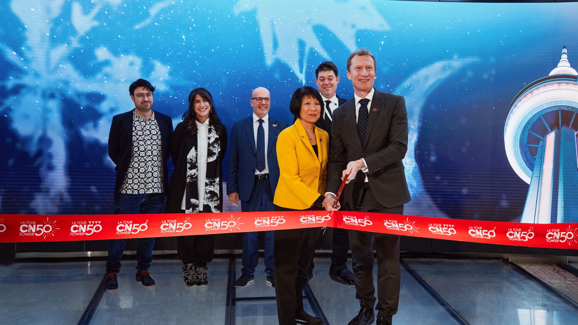 Image showing people standing together for a ribbon cutting event