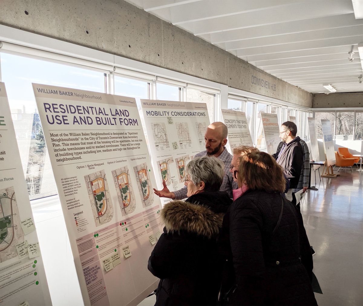 Group of people reviewing presentation boards