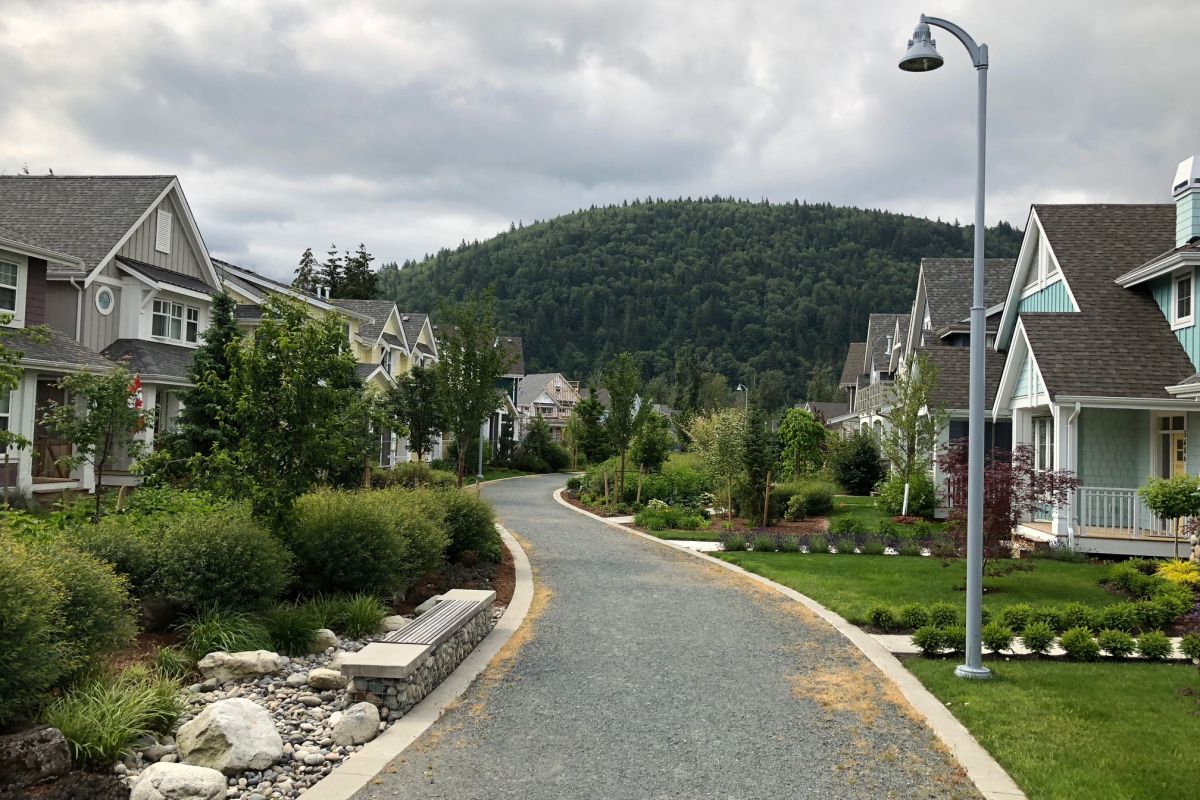 River's Edge showing homes on both sides of a pathway
