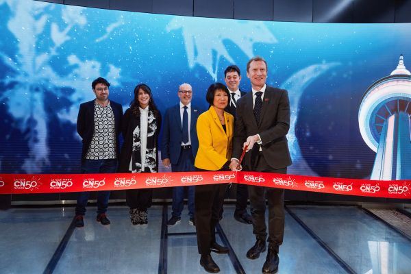 Image showing people standing together for a ribbon cutting event